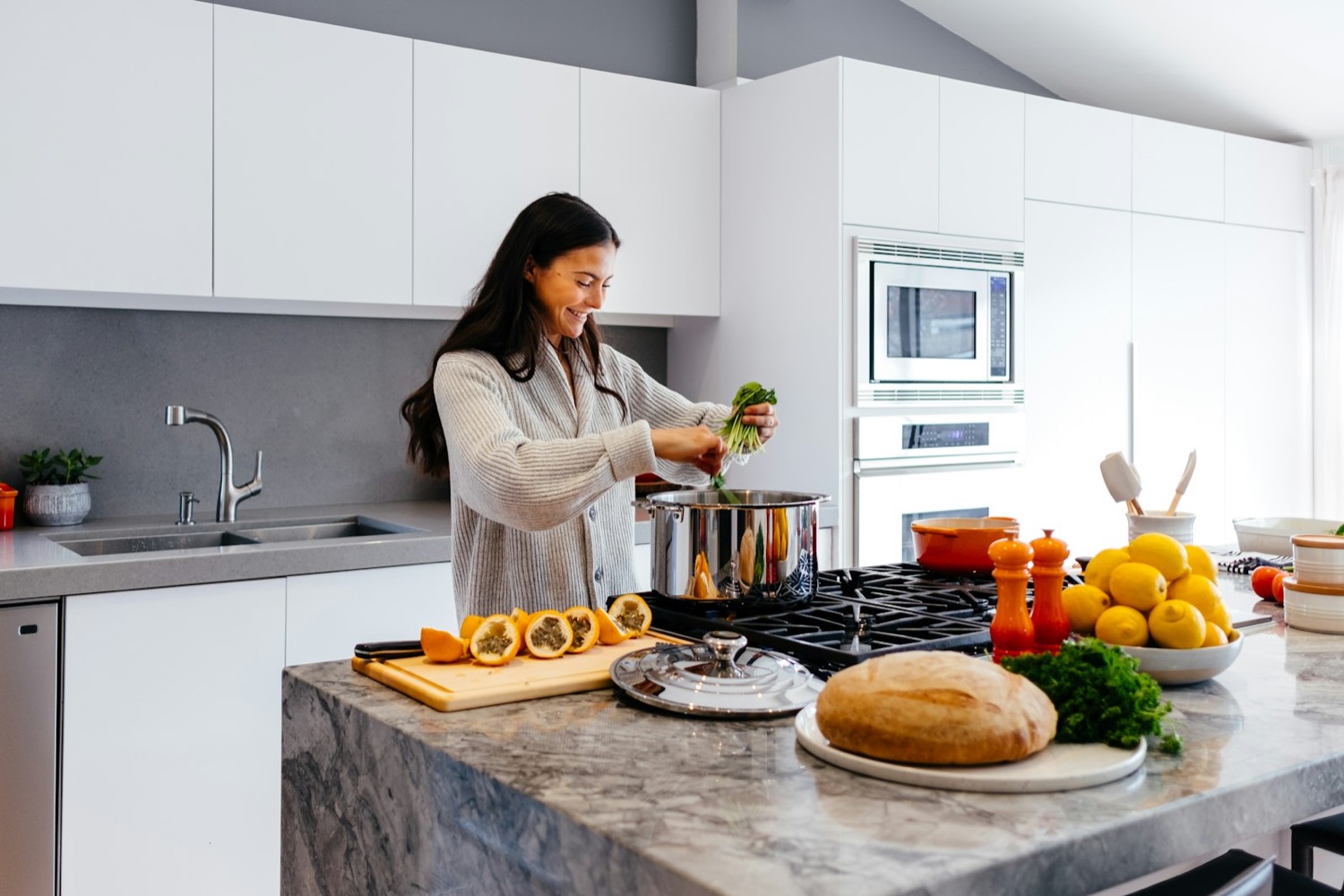 A person cooking a healthy meal in a bright modern kitchen